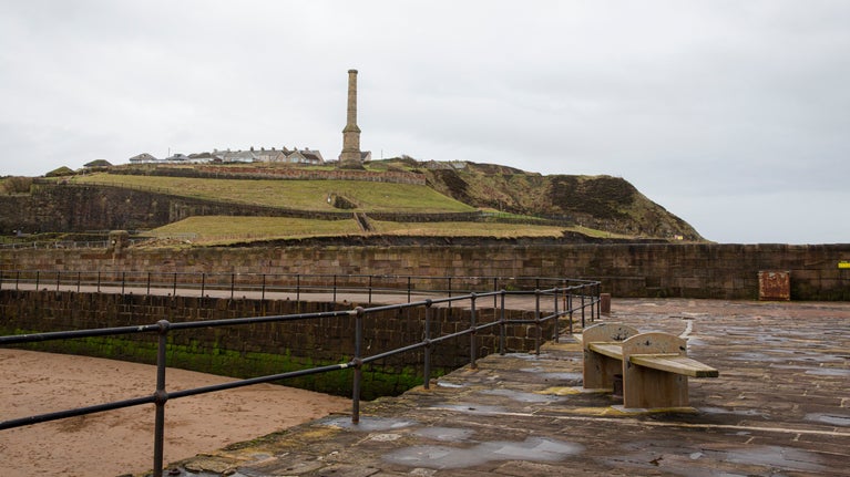 View of the Candlestick Chimney across the harbour at the Whitehaven Coast in winter, Cumbria